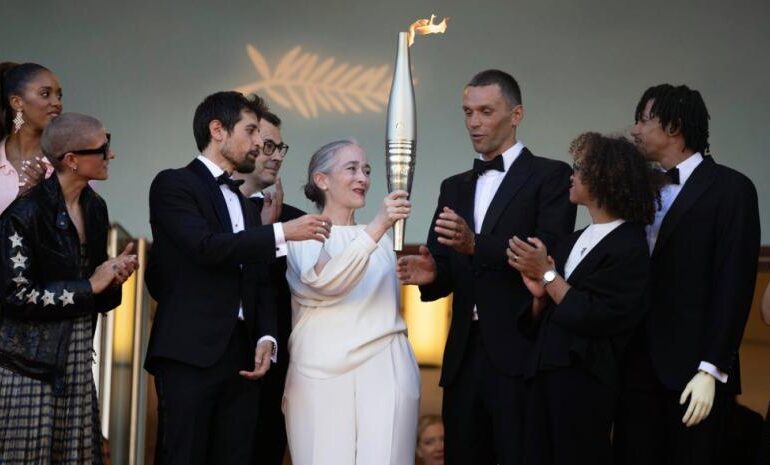 Cannes y los Juegos Olímpicos se unen con la antorcha paseando por la alfombra roja